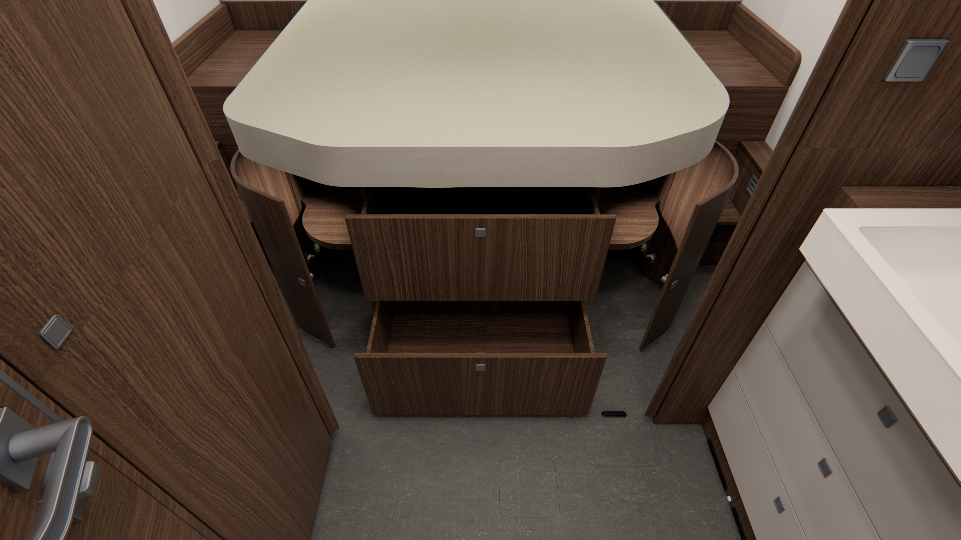 Ein kompaktes Schlafzimmer verfügt über ein Bett mit beiger Bettwäsche, Holzschränke mit offenen Türen und Schubladen darunter sowie einen Teil einer Arbeitsplatte mit Schubladen auf der rechten Seite. Der Boden ist dunkel und der Raum ist geschlossen.