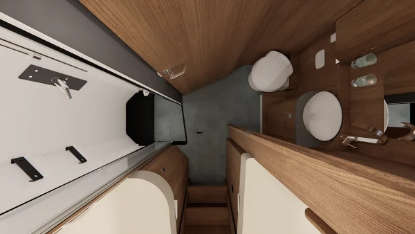 Draufsicht auf ein kompaktes Badezimmer in einem Carthago C2-Tourer mit Toilette, Waschbecken, Duschbereich und Holzschränken. Der Raum ist übersichtlich und modern gestaltet, mit grauem Bodenbelag und hellen Holzoberflächen.