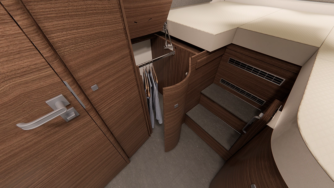 Ansicht eines kompakten, modernen Kleiderschranks aus Holz mit Kleiderstange, Schubladen und einer Treppe, die zum Bett hinaufführt, in einem kleinen, übersichtlichen Wohnbereich – perfekt abgestimmt auf das durchdachte Design der Carthago Chic E-Linie.