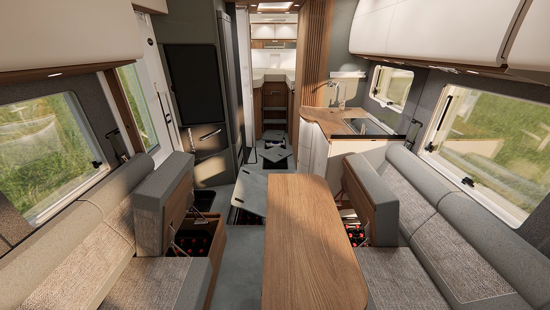 Der Innenraum eines modernen Carthago C2-Tourer-Wohnmobils mit grauen Sitzgelegenheiten, Holzakzenten, einem Esstisch, einer kleinen Küchenzeile mit Spüle, Schränken, Fenstern und einfallendem Tageslicht schafft einen gemütlichen und funktionalen Wohnraum.